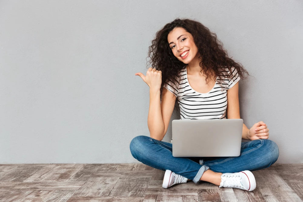 Woman happy with her laptop